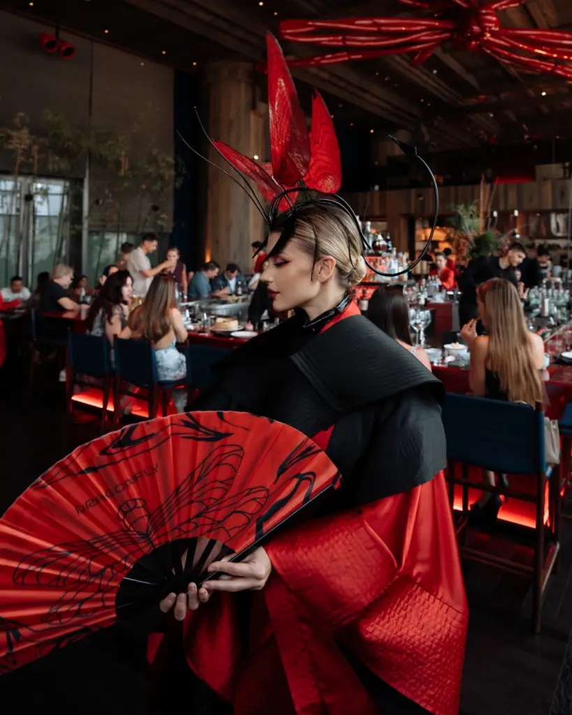 The Metamorphosis Brunch takes place every Saturday from 1:00 PM to 4:00 PM at Dragonfly, located in The Lana Promenade by Dorchester Collection. Pricing options include AED 345 with soft drinks, AED 495 with spirit mixers and cocktails, AED 525 with wine and prosecco, and AED 695 for the Champagne Perrier-Jouet package.