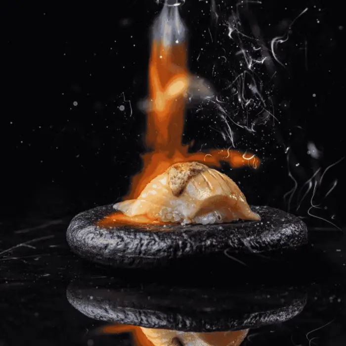 Narnia's inventive menu offers surprises like sushi without rice, and fish with white asparagus and cauliflower rice. Desserts include wagashi mochi and coconut “udon” pasta. Each dish pushes creative boundaries.