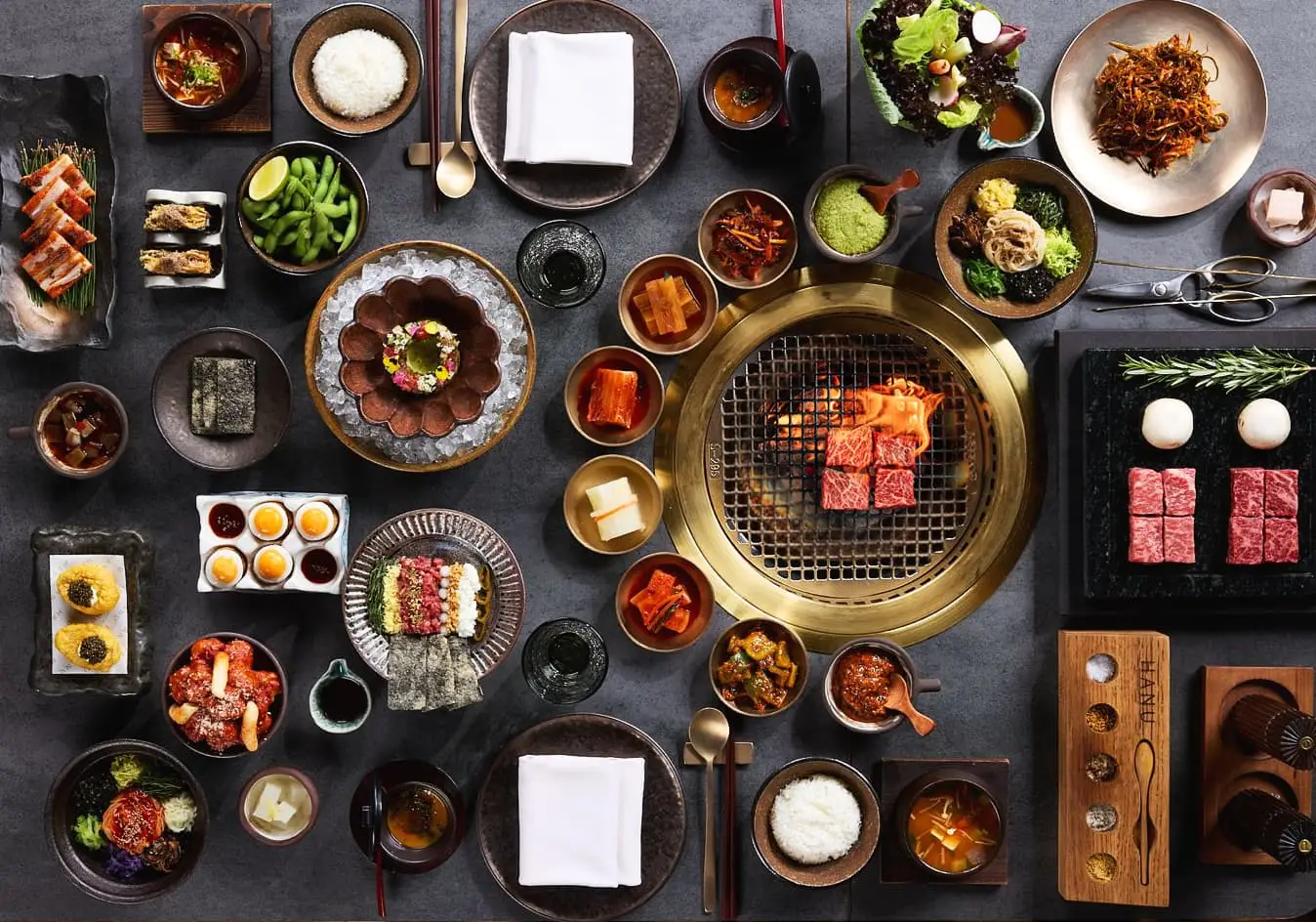 HANU on Palm Jumeirah launches Hansang Lunch (AED 195 per person, Saturdays 1 PM-4 PM). Enjoy a premium Korean "full table" feast with Wagyu, Banchan, and Truffle Kimbap.