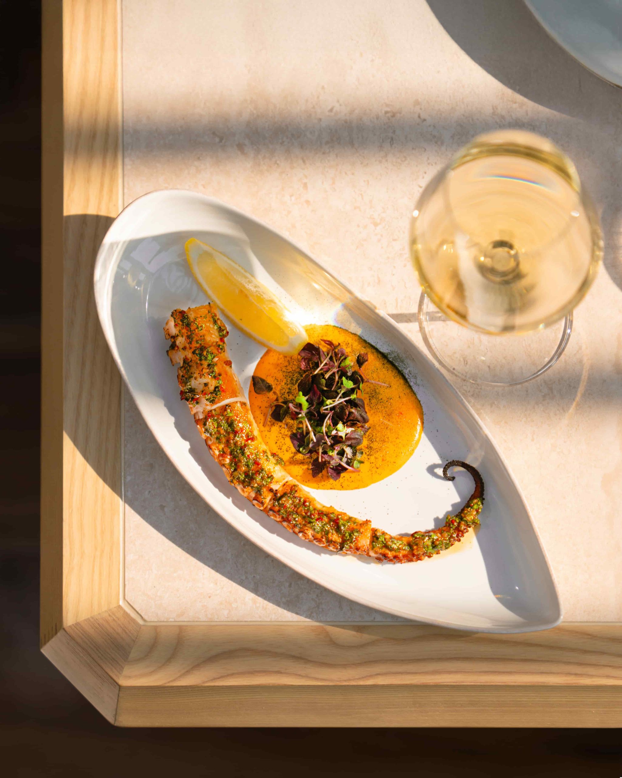 Chef Saradhi Dakara opens Orilla in JVT, Dubai. Experience a unique MediterrAsian menu, sustainable design featuring recycled oyster shells, and soulful coastal vibes.