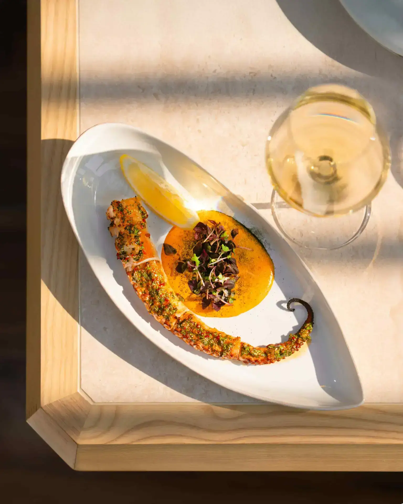 Chef Saradhi Dakara opens Orilla in JVT, Dubai. Experience a unique MediterrAsian menu, sustainable design featuring recycled oyster shells, and soulful coastal vibes.