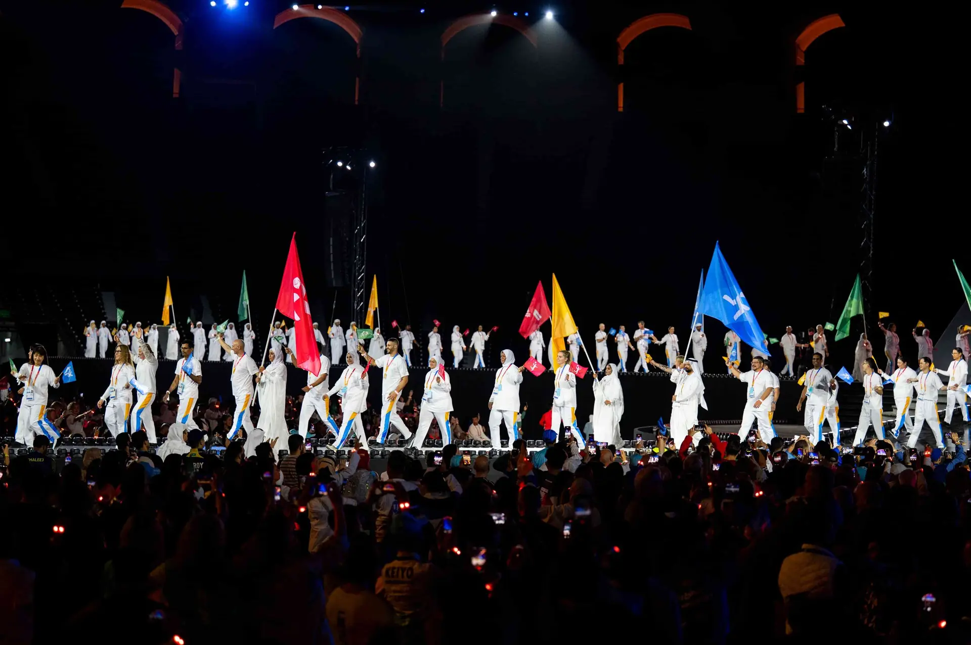 Athletes onstage during the Welcome Ceremony for the Open Masters Games Abu Dhabi 2026 at Zayed Sports City Stadium in Abu Dhabi, United Arab Emirates on February 06, 2026. (Photo by Mohamed Hossam / OMGAD2026)