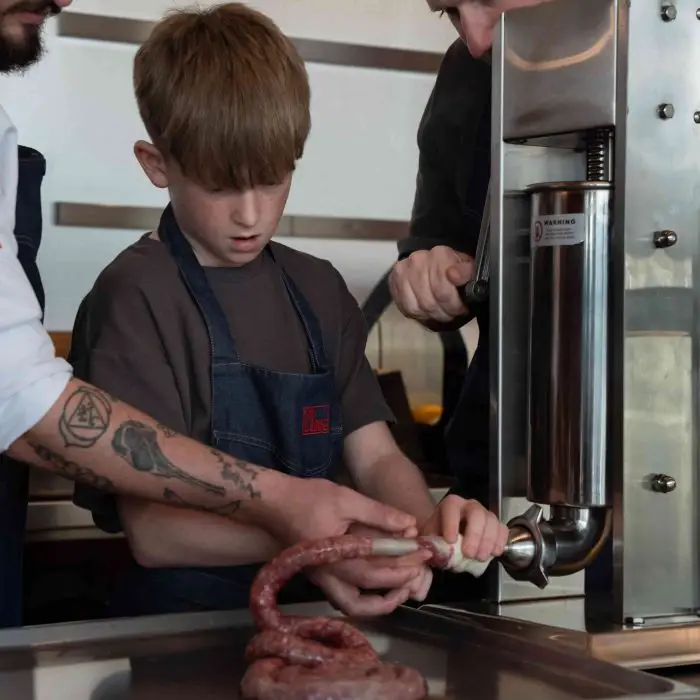 Learn how to make the perfect Beef Wellington at Fin & Bone Al Barari. New butchery masterclasses include sausage making and technical meat preparation.