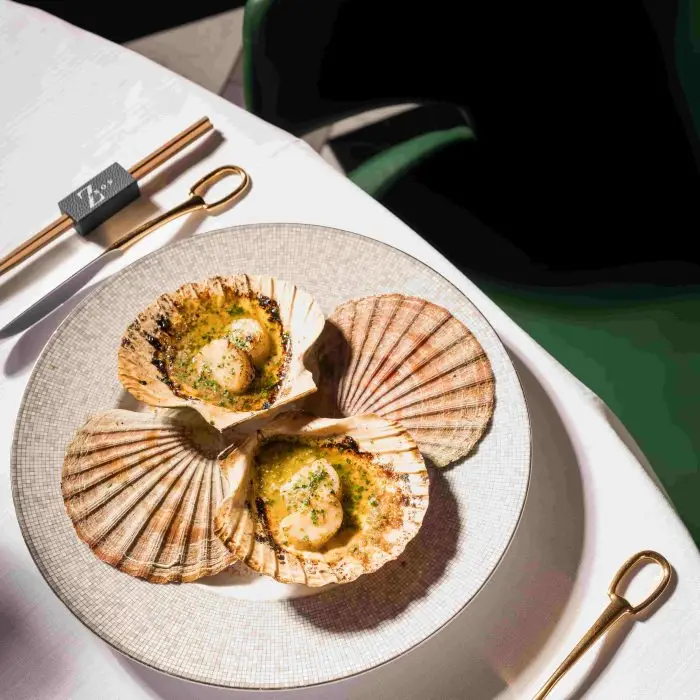 Savour a beautiful three-course Mediterranean sunset menu at Zenon Dubai. Experience exquisite dishes like Hokkaido scallops and truffle beef cheeks in Downtown Dubai.