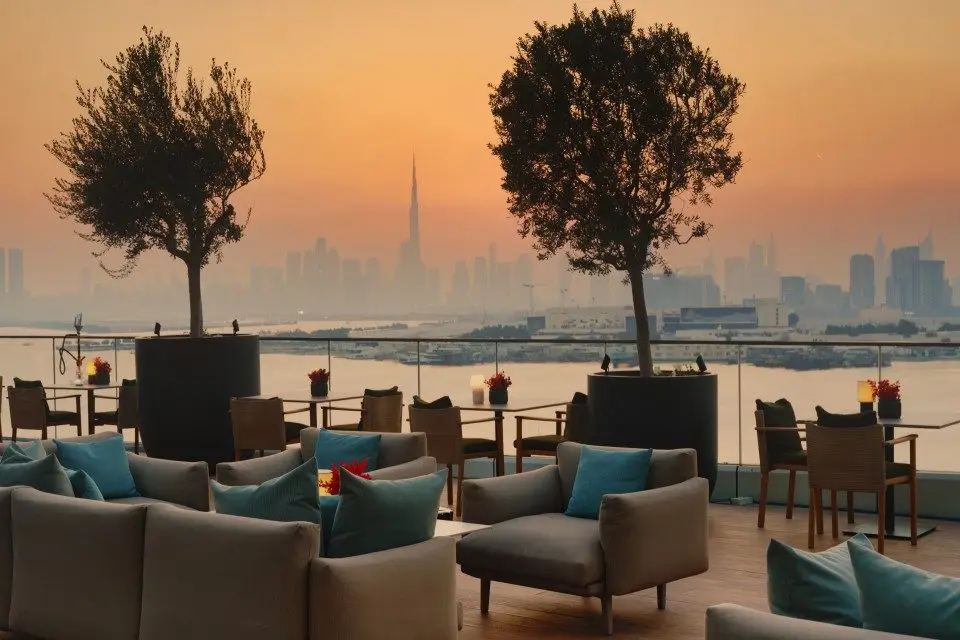 Sunset comes with a view here. Luma Pool Lounge's Happy Hour runs daily from 3pm to 7pm, with drinks starting at AED 30, an easy way to ease into the evening against the backdrop of Dubai Creek Harbour. The hotel has a few other September offers running too, including a weekday Business Lunch and a new TWG Tea afternoon tea, for anyone looking to make a full day of it. Afternoon Tea, 442 Metres Above Dubai Contact photo From Farah on 2026-09-07 09:27 Details Headers Plain text To protect your privacy remote resources have been blocked. Afternoon Tea, 442 Metres Above Dubai A delightful selection of sweet and savoury favourites, served with a choice of beverages for a leisurely afternoon above the city High -res images here Afternoon tea takes on a different setting at At.mosphere Lounge, where guests can enjoy the tradition 442 metres above Dubai, with panoramic views of the city from Level 122 of Burj Khalifa. The menu brings together delicate mini sandwiches, freshly baked scones with clotted cream and jams, and a selection of cakes and pastries, served alongside a choice of hot and refreshing beverages. It is an afternoon tea that gives guests time to enjoy the food, the views, and the company. Guests can choose from three afternoon tea experiences. La Gourmandise, priced at AED 350 per person, includes the full selection of sweet and savoury bites with unlimited hot and refreshing beverages. Sparkling High Tea, at AED 550 per person, includes two glasses of Prosecco per person, with the option to add a main course. For a more celebratory experience, Luxurious High Tea, priced at AED 850 per person, includes a bottle of champagne for two, a main course, and the full afternoon tea selection. With its views across Dubai and a menu made for taking your time, At.mosphere offers a memorable setting for an afternoon tea. Date and time: Daily | 12:30 PM – 4:30 PM Price: La Gourmandise AED 350 per person | Sparkling High Tea AED 550 per person | Luxurious High Tea AED 850 per person Location: At.mosphere Lounge, Burj Khalifa For reservations and more information, please visit [www.atmosphererestaurant.com](https://www.atmosphererestaurant.com) or contact the reservations team at reservations@atmosphereburjkhalifa.com or +971 4 888 3828. -END- About At.mosphere, Burj Khalifa Located on Level 122 of the iconic Burj Khalifa, 442 metres above Dubai, At.mosphere is a world-renowned dining and lifestyle destination offering two distinct experiences under one roof: At.mosphere Restaurant and At.mosphere Lounge & Bar. Recognised by Guinness World Records as the highest restaurant from ground level, At.mosphere also holds the distinction of being the highest restaurant in the Middle East and the second-highest restaurant in the world. Framed by uninterrupted 360-degree views, it offers a front-row seat to Dubai's ever-changing skyline from sunrise to late night. At.mosphere Restaurant presents contemporary French fine dining in an extraordinary setting where every meal is paired with spectacular views above the city. From elegant lunches and intimate dinners to exceptional culinary experiences, the restaurant combines refined flavours, seasonal ingredients, and impeccable service, creating moments that are as memorable as the setting itself. At.mosphere Lounge & Bar welcomes guests from breakfast through to late night, offering relaxed mornings above the city, signature high teas, handcrafted cocktails, curated bites, and an atmosphere that evolves throughout the day. As daylight gives way to dusk, the lounge transforms into one of Dubai's most captivating social destinations, where live DJ sets, crafted drinks, and panoramic views create an unforgettable backdrop. For guests dining at At.mosphere Restaurant, the experience continues seamlessly at the Lounge & Bar, allowing them to move effortlessly from the table to the bar without ever leaving the skyline behind. Together, At.mosphere Restaurant and At.mosphere Lounge & Bar create a complete destination where guests can dine, unwind, celebrate, and experience Dubai from an entirely new perspective. At.mosphere blends award-winning cuisine, thoughtful hospitality, immersive day-to-night experiences, and one of the world's most iconic settings to redefine dining above the city. For more information, visit [www.atmosphereburjkhalifa.com](https://www.atmosphereburjkhalifa.com). About Emaar Hospitality Group Emaar Hospitality Group is a global leader in luxury hospitality and lifestyle experiences, creating exceptional hotels, residences, restaurants, leisure destinations, and wellness experiences that enrich lifestyles and create memorable moments. Headquartered in Dubai, the Group manages a diverse international portfolio across the United Arab Emirates, Saudi Arabia, Bahrain, Egypt, Milan, and Türkiye. Its hospitality portfolio includes Address Hotels + Resorts, Vida Hotels and Resorts, Palace Hotels + Resorts, Armani Hotels and Resorts, and Al Alamein Hotel, each delivering distinctive guest experiences through exceptional service, contemporary design, and authentic hospitality. Complementing its hotel portfolio, Emaar Hospitality Group also manages an extensive collection of branded residences and serviced apartments, extending its signature hospitality experience beyond every stay. Beyond its hotels and residences, the Group operates an extensive collection of leisure and lifestyle destinations, including Dubai Hills Golf Club, Montgomerie Golf Club Dubai, Arabian Ranches Golf Club, Dubai Polo & Equestrian Club, Dubai Marina Yacht Club, Creek Marina Yacht Club, Veo, and award-winning dining destinations such as At.mosphere, Thiptara, Mausam, and many more. The Group also offers bespoke wedding experiences through Weddings by Emaar, bringing together distinctive venues, personalised planning, exceptional culinary offerings, and dedicated services for memorable celebrations. Through its U By Emaar loyalty programme, Emaar Hospitality Group continues to deliver personalised experiences and exceptional service while redefining luxury hospitality across its growing international portfolio. For more information, visit [www.emaarhospitality.com](https://www.emaarhospitality.com) farah If you would no longer like to receive mail from us you can Unsubscribe Means Design, Al Wasl Business Central, Dubai, United Arab Emirates Means Design, Al Wasl Business Central, Dubai, -, United Arab Emirates Afternoon Tea, 442 Metres Above Dubai Contact photo From Farah on 2026-09-07 09:27 Details Headers Plain text To protect your privacy remote resources have been blocked. Afternoon Tea, 442 Metres Above Dubai A delightful selection of sweet and savoury favourites, served with a choice of beverages for a leisurely afternoon above the city High -res images here Afternoon tea takes on a different setting at At.mosphere Lounge, where guests can enjoy the tradition 442 metres above Dubai, with panoramic views of the city from Level 122 of Burj Khalifa. The menu brings together delicate mini sandwiches, freshly baked scones with clotted cream and jams, and a selection of cakes and pastries, served alongside a choice of hot and refreshing beverages. It is an afternoon tea that gives guests time to enjoy the food, the views, and the company. Guests can choose from three afternoon tea experiences. La Gourmandise, priced at AED 350 per person, includes the full selection of sweet and savoury bites with unlimited hot and refreshing beverages. Sparkling High Tea, at AED 550 per person, includes two glasses of Prosecco per person, with the option to add a main course. For a more celebratory experience, Luxurious High Tea, priced at AED 850 per person, includes a bottle of champagne for two, a main course, and the full afternoon tea selection. With its views across Dubai and a menu made for taking your time, At.mosphere offers a memorable setting for an afternoon tea. Date and time: Daily | 12:30 PM – 4:30 PM Price: La Gourmandise AED 350 per person | Sparkling High Tea AED 550 per person | Luxurious High Tea AED 850 per person Location: At.mosphere Lounge, Burj Khalifa For reservations and more information, please visit www.atmosphererestaurant.com or contact the reservations team at reservations@atmosphereburjkhalifa.com or +971 4 888 3828. -END- About At.mosphere, Burj Khalifa Located on Level 122 of the iconic Burj Khalifa, 442 metres above Dubai, At.mosphere is a world-renowned dining and lifestyle destination offering two distinct experiences under one roof: At.mosphere Restaurant and At.mosphere Lounge & Bar. Recognised by Guinness World Records as the highest restaurant from ground level, At.mosphere also holds the distinction of being the highest restaurant in the Middle East and the second-highest restaurant in the world. Framed by uninterrupted 360-degree views, it offers a front-row seat to Dubai's ever-changing skyline from sunrise to late night. At.mosphere Restaurant presents contemporary French fine dining in an extraordinary setting where every meal is paired with spectacular views above the city. From elegant lunches and intimate dinners to exceptional culinary experiences, the restaurant combines refined flavours, seasonal ingredients, and impeccable service, creating moments that are as memorable as the setting itself. At.mosphere Lounge & Bar welcomes guests from breakfast through to late night, offering relaxed mornings above the city, signature high teas, handcrafted cocktails, curated bites, and an atmosphere that evolves throughout the day. As daylight gives way to dusk, the lounge transforms into one of Dubai's most captivating social destinations, where live DJ sets, crafted drinks, and panoramic views create an unforgettable backdrop. For guests dining at At.mosphere Restaurant, the experience continues seamlessly at the Lounge & Bar, allowing them to move effortlessly from the table to the bar without ever leaving the skyline behind. Together, At.mosphere Restaurant and At.mosphere Lounge & Bar create a complete destination where guests can dine, unwind, celebrate, and experience Dubai from an entirely new perspective. At.mosphere blends award-winning cuisine, thoughtful hospitality, immersive day-to-night experiences, and one of the world's most iconic settings to redefine dining above the city. For more information, visit www.atmosphereburjkhalifa.com. About Emaar Hospitality Group Emaar Hospitality Group is a global leader in luxury hospitality and lifestyle experiences, creating exceptional hotels, residences, restaurants, leisure destinations, and wellness experiences that enrich lifestyles and create memorable moments. Headquartered in Dubai, the Group manages a diverse international portfolio across the United Arab Emirates, Saudi Arabia, Bahrain, Egypt, Milan, and Türkiye. Its hospitality portfolio includes Address Hotels + Resorts, Vida Hotels and Resorts, Palace Hotels + Resorts, Armani Hotels and Resorts, and Al Alamein Hotel, each delivering distinctive guest experiences through exceptional service, contemporary design, and authentic hospitality. Complementing its hotel portfolio, Emaar Hospitality Group also manages an extensive collection of branded residences and serviced apartments, extending its signature hospitality experience beyond every stay. Beyond its hotels and residences, the Group operates an extensive collection of leisure and lifestyle destinations, including Dubai Hills Golf Club, Montgomerie Golf Club Dubai, Arabian Ranches Golf Club, Dubai Polo & Equestrian Club, Dubai Marina Yacht Club, Creek Marina Yacht Club, Veo, and award-winning dining destinations such as At.mosphere, Thiptara, Mausam, and many more. The Group also offers bespoke wedding experiences through Weddings by Emaar, bringing together distinctive venues, personalised planning, exceptional culinary offerings, and dedicated services for memorable celebrations. Through its U By Emaar loyalty programme, Emaar Hospitality Group continues to deliver personalised experiences and exceptional service while redefining luxury hospitality across its growing international portfolio. give me one for this - no need to rewrite the whole thing
