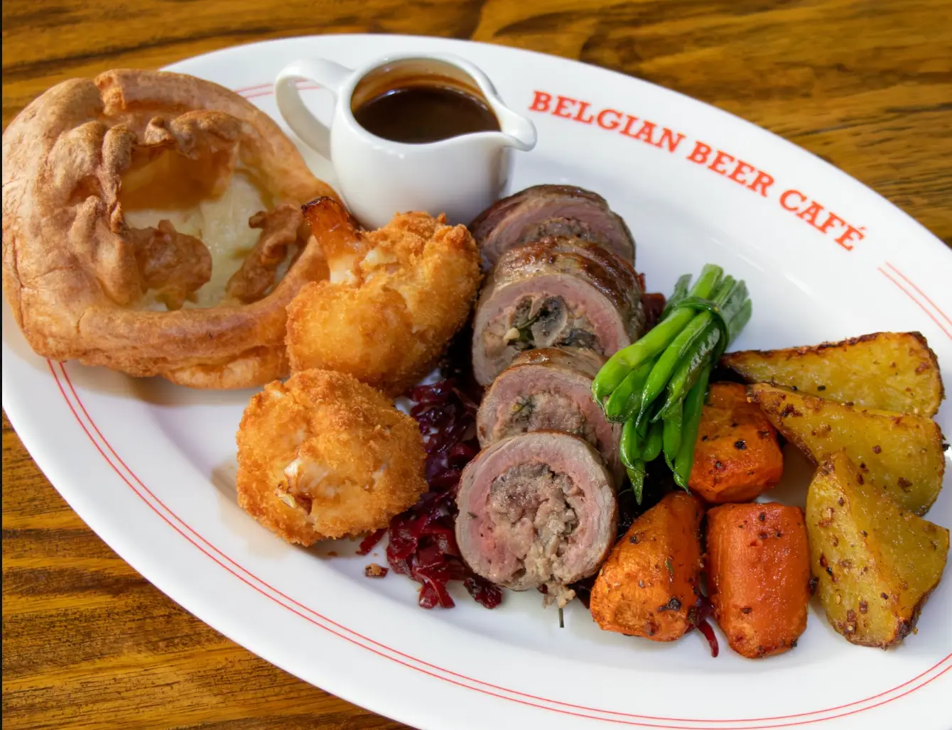 Belgian Beer Café at Grand Millennium Dubai is serving a beef tenderloin roast stuffed with mushroom and cheese, created by Chef Sree. Available every Sunday throughout September from noon until 1am, the AED 99 roast comes with the usual trimmings: roasted carrots and potatoes, beans, fried cauliflower, braised red cabbage and Yorkshire pudding, alongside a peppercorn sauce. It's served with a pint of Belgian beer or a glass of house wine, making it a full Sunday meal rather than just a plate of food. The café is in Barsha Heights.