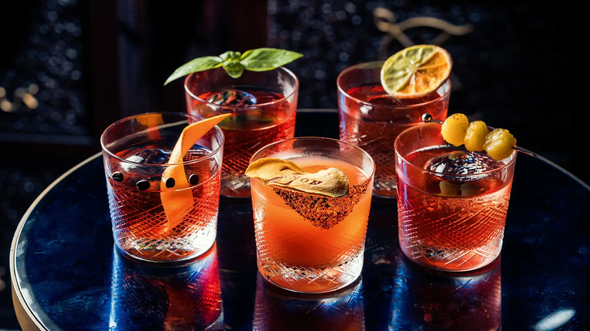 Negroni Week lands at Zenon from 21 to 27 September, and the bar team hasn't held back. Five reinterpretations of the classic are on the menu, each pushing the bitter-sweet formula somewhere unexpected. Try Tropical, built on kumquat-infused gin and pineapple, at AED 75. Or go bolder with Spiced Mango, made with Thai chilli-infused gin, at AED 80. Matcha brings an earthy, distinctly Japanese edge, also AED 80. Berry & Basil leans botanical, with lemongrass gin and fresh basil, AED 80. And for something smokier, Smoked Coffee combines mezcal with coffee-infused vermouth, at AED 90. Each is designed to sit comfortably alongside Zenon's Mediterranean-Asian menu.